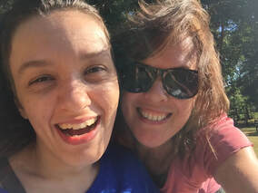 Selfie of Sabriina and Julie smiling at the camera. Julie is wearing sunglasses.