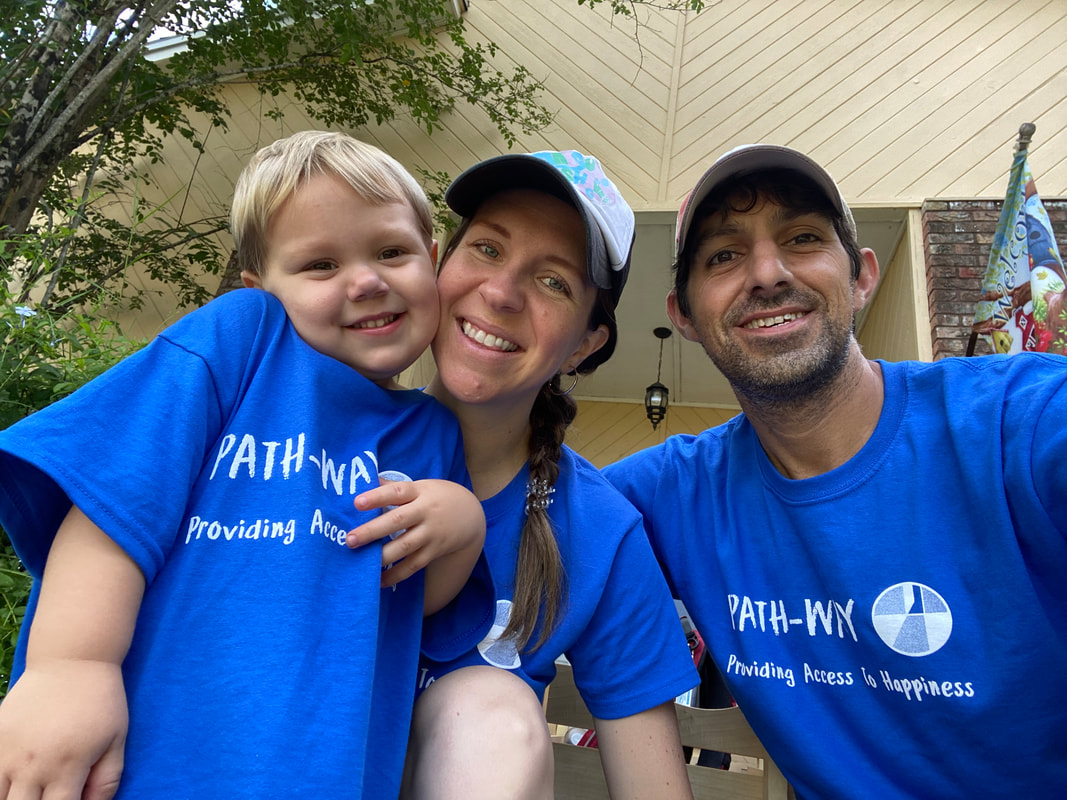 Selfie of Ayden, Chelsea, and Greg wearing blue ReImagined Picnic T-Shirts.